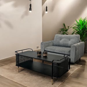 Table basse noire pieds dorés double plateau